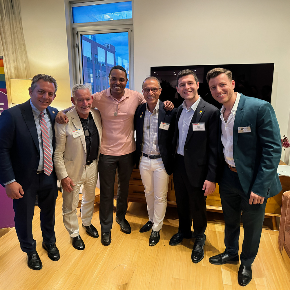 Group of attendees posing together and smiling