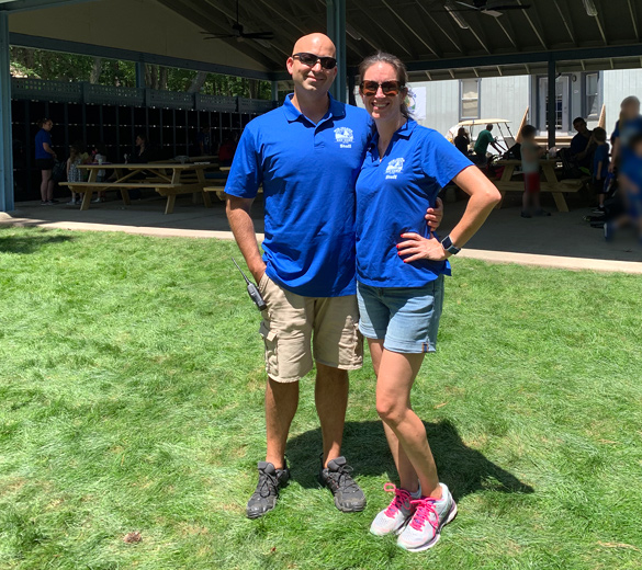 UJA Federation of New York >> <p>Josh and Risa Henkel, standing under the Mid-Island Y JCC Day Camps new home base</p>