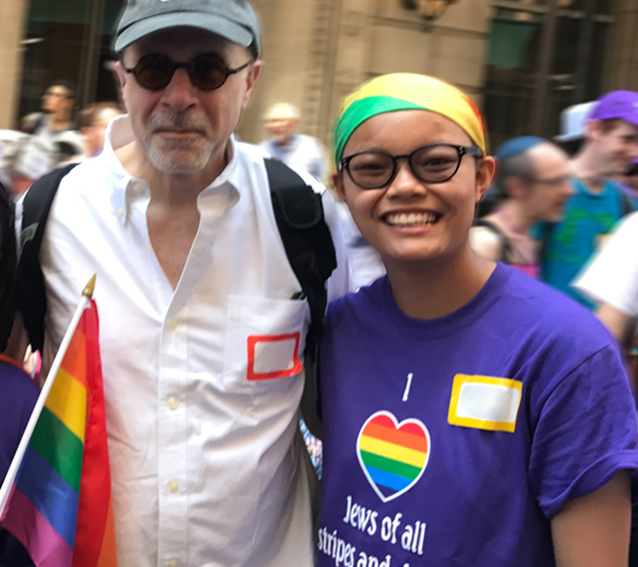 UJA Federation of New York >> Yakira, a participant in the Keshet Jewish LGBTQ Teen Enagement Initiative in Westchester, with her dad at the 2017 NYC Pride March.
