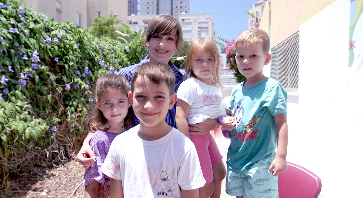 UJA Federation of New York >> <p style="text-align: justify;"><em>Yulia and family (Leon in foreground)</em></p>